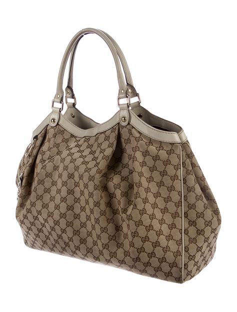 gucci metallic tote with metallic gg logo|gucci canvas large tote.